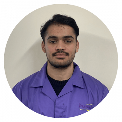 Staff member in uniform with facility logo