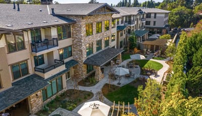 View of outdoor patio area with seating and walkways.