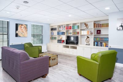 Common area with seating and bookshelves