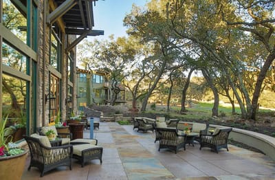 Outdoor seating area with garden views.