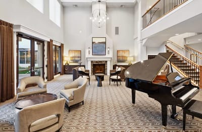 Elegant common area with piano and seating