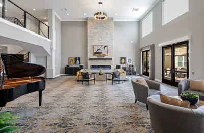 Elegant common area with piano and seating.
