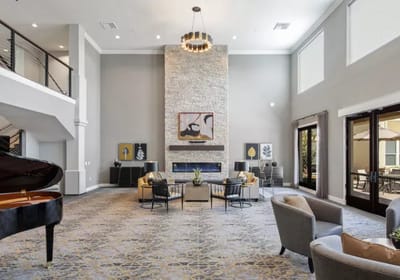 Spacious lobby with elegant decor and seating areas.