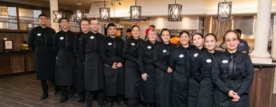 Catering staff posing in the kitchen
