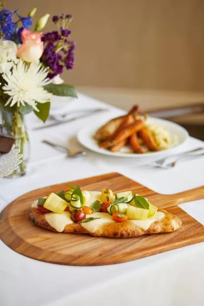 Gourmet meal served on a wooden platter