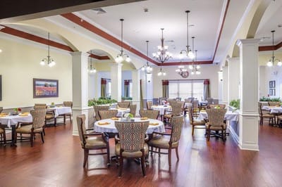 Elegant dining room setup with tables and chairs