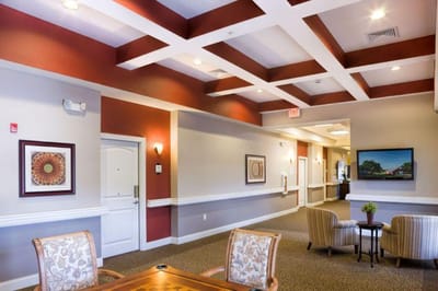 Interior view of a common area with chairs and artwork