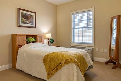 Cozy private resident room with a bed and window