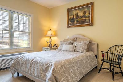 Cozy resident room with a bed and painting