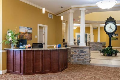 Interior view of the facility reception area with clock