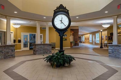 Common area with a large clock model and beautiful decor