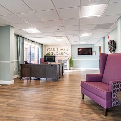 Interior view of a reception area with a desk and seating