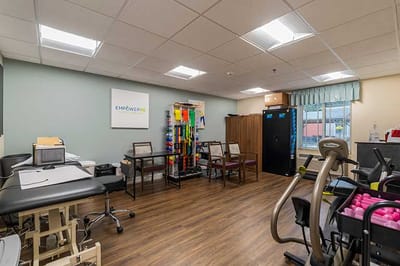 Therapy room with exercise equipment and supplies