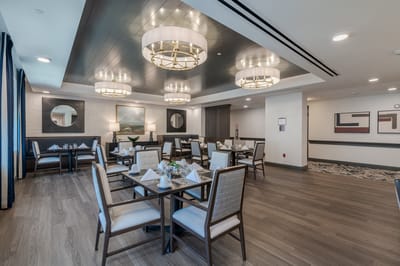 Elegant dining room with tables set for a meal