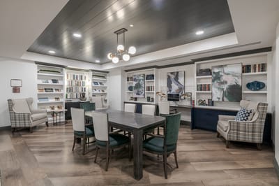 Common area with bookshelves and seating