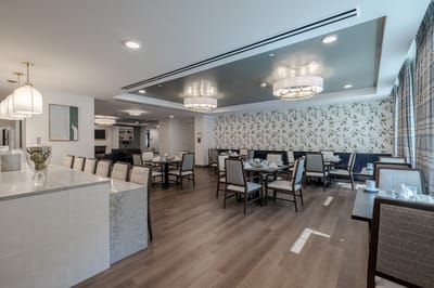 Modern dining room with floral wallpaper and tables