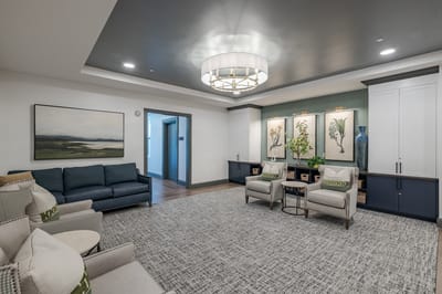 Bright common area with comfortable seating and artwork