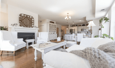 Bright common area with white furniture and natural light