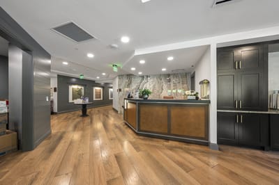 Modern lobby area with reception desk and decor