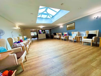 Interior view of a bright common area with seating