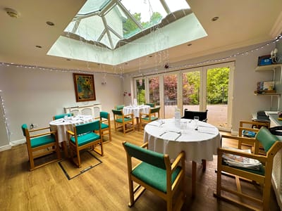 Bright dining room with tables and chairs