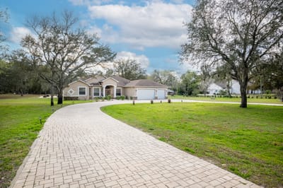 Exterior view of Aliviya Rose Manor with a walkway
