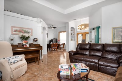 Interior view of a common area with seating and piano
