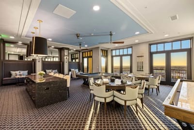 Brightly lit common area with seating and tables
