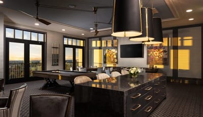 Luxurious common area with pool table and large windows