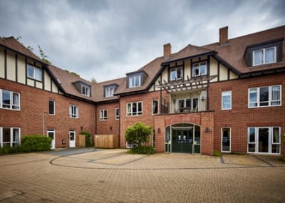 Facade of Ascot Grange Care Home with outdoor space