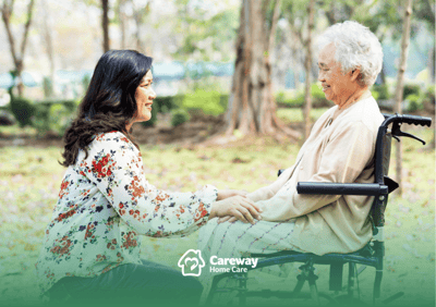 Caregiver interacting with a resident in a garden