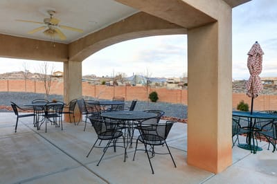 Outdoor seating area with tables and umbrellas