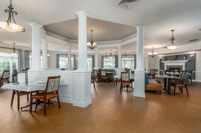 Interior view of a dining room with tables and chairs