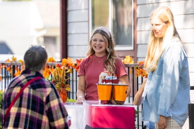 Staff and residents engaging during an outdoor event