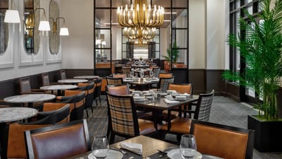Elegant dining room with tables set for a meal