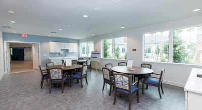 Bright common area with tables and chairs