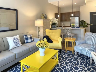 Bright common area with cozy seating and decor