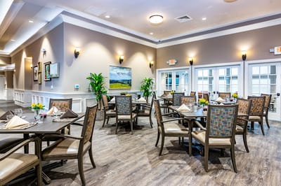 Dining area with tables set for a meal.