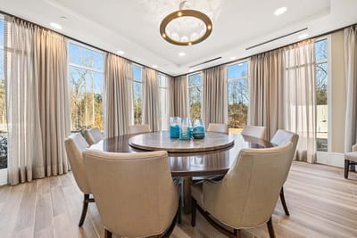 Bright dining area with a large circular table