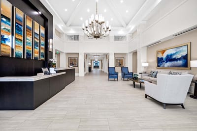 Interior view of a bright lobby area with seating