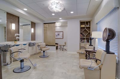 Beauty salon interior with styling chairs and mirrors