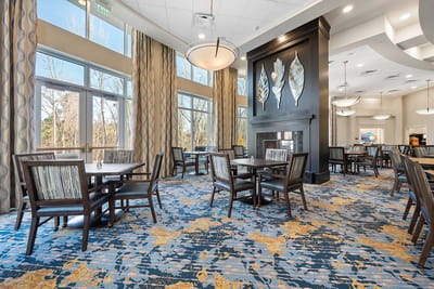 Dining area with tables and large windows