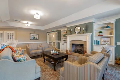 Cozy lounge area with comfortable seating and fireplace