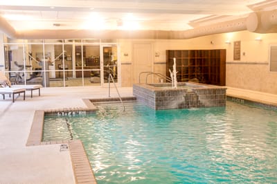 Indoor swimming pool area with a fountain