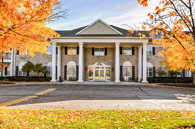 Exterior view of Brookdale Muirfield in autumn