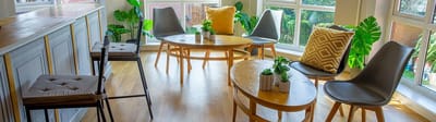 Bright common area with modern furniture and plants