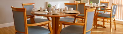 Well-set dining room with tables and dishes