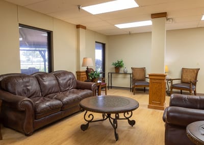 Cozy common area with leather sofas and natural light