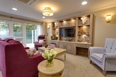 Comfortable common area with seating and decorative shelves
