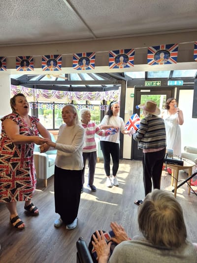 Residents enjoying a lively activity in a common area